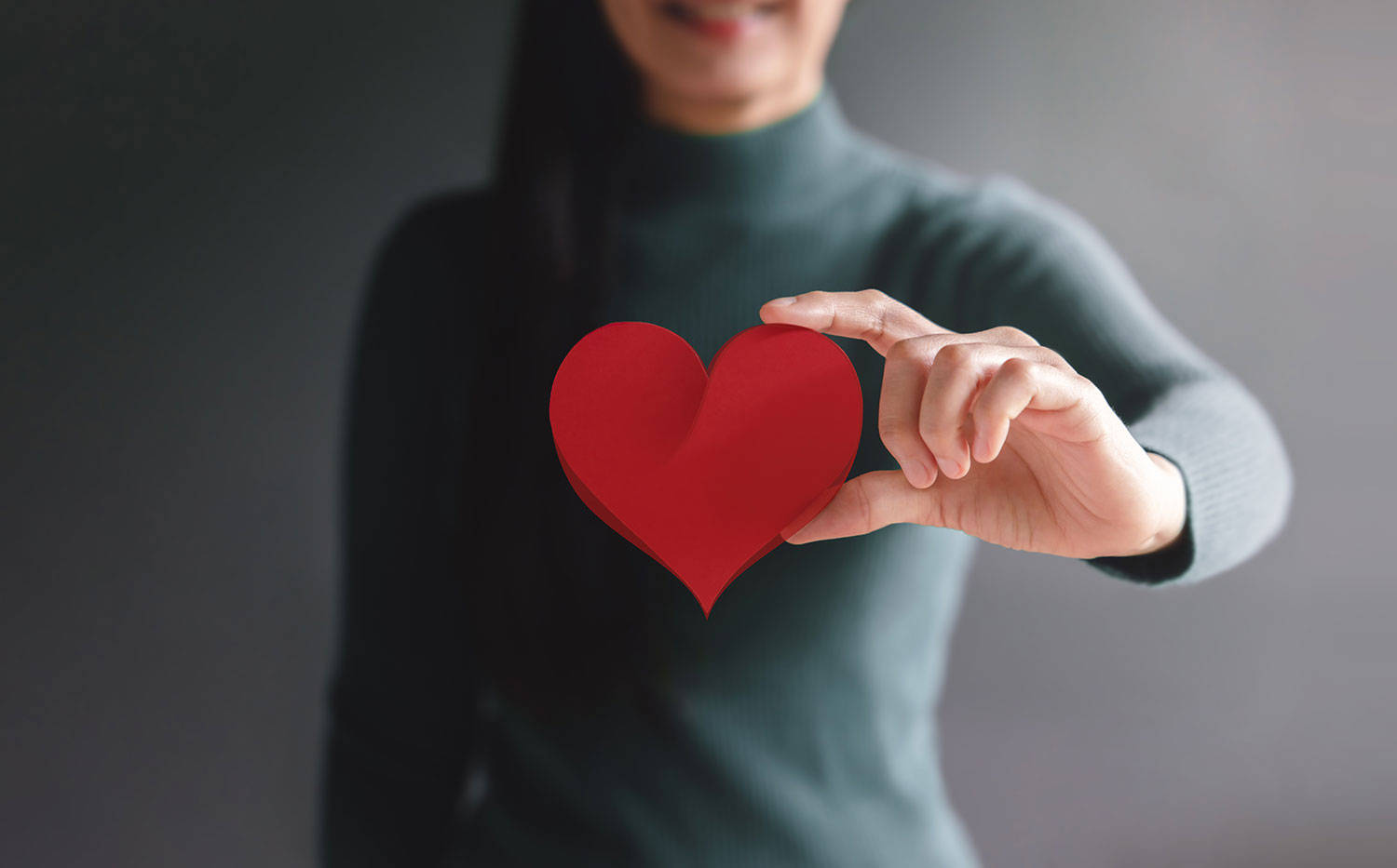 Woman holding heart